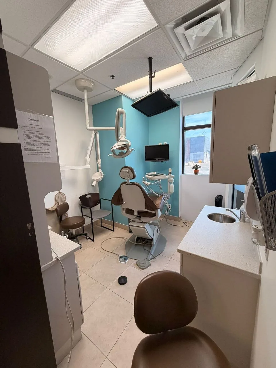 Dental treatment operatory with exam chair and overhead light